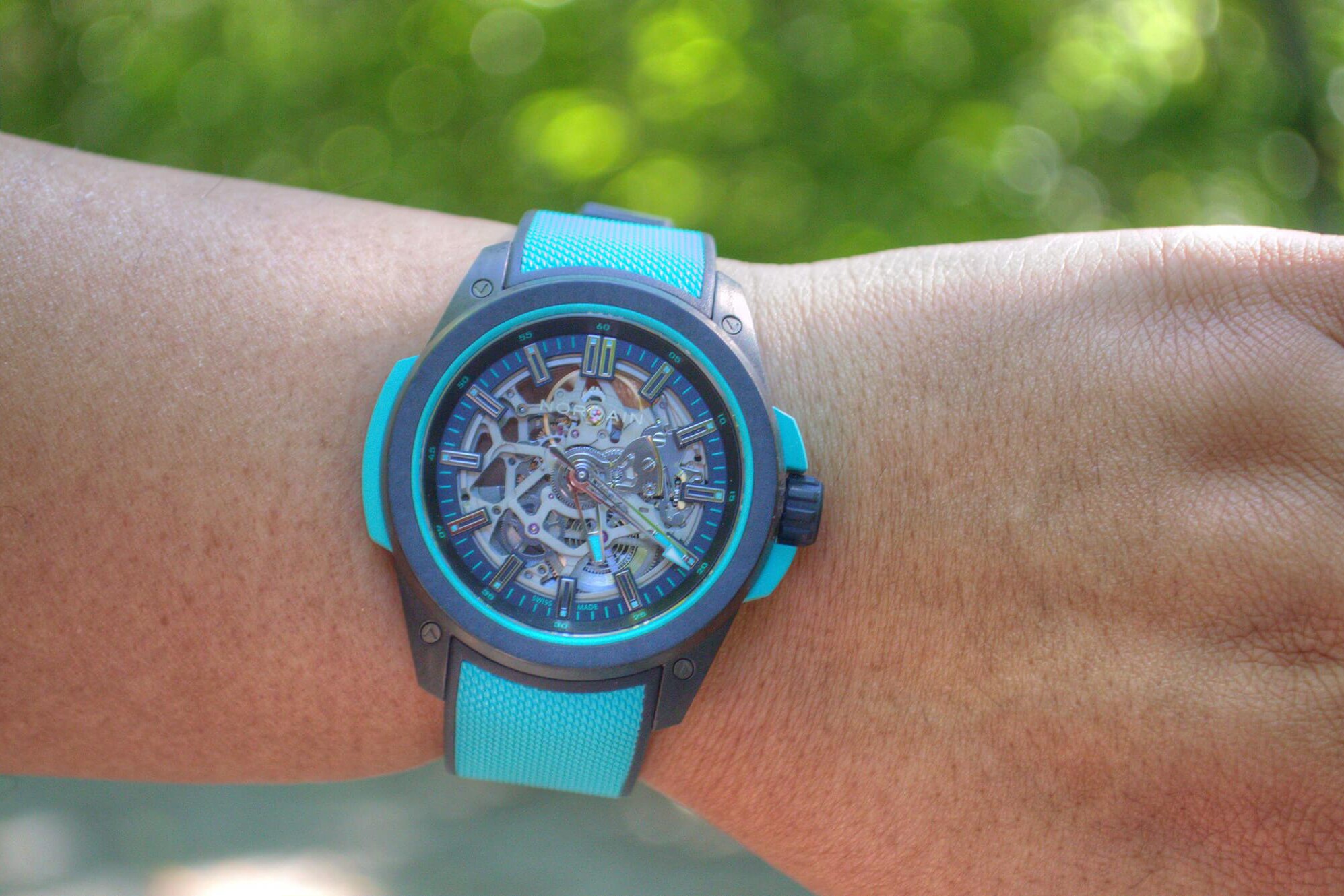 NORQAIN Wild ONE Skeleton Turquoise 42mm watch with NORTEQ carbon-fibre case and turquoise rubber strap